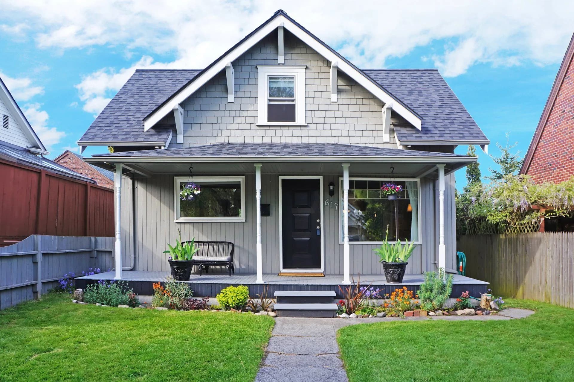Gray craftsman home in Calvert County with freshly painted siding and white trim